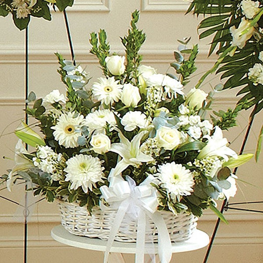 White Sympathy Flowers in Long Wicker Basket