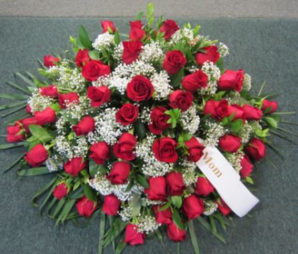 red rose casket spray funeral flower delivery